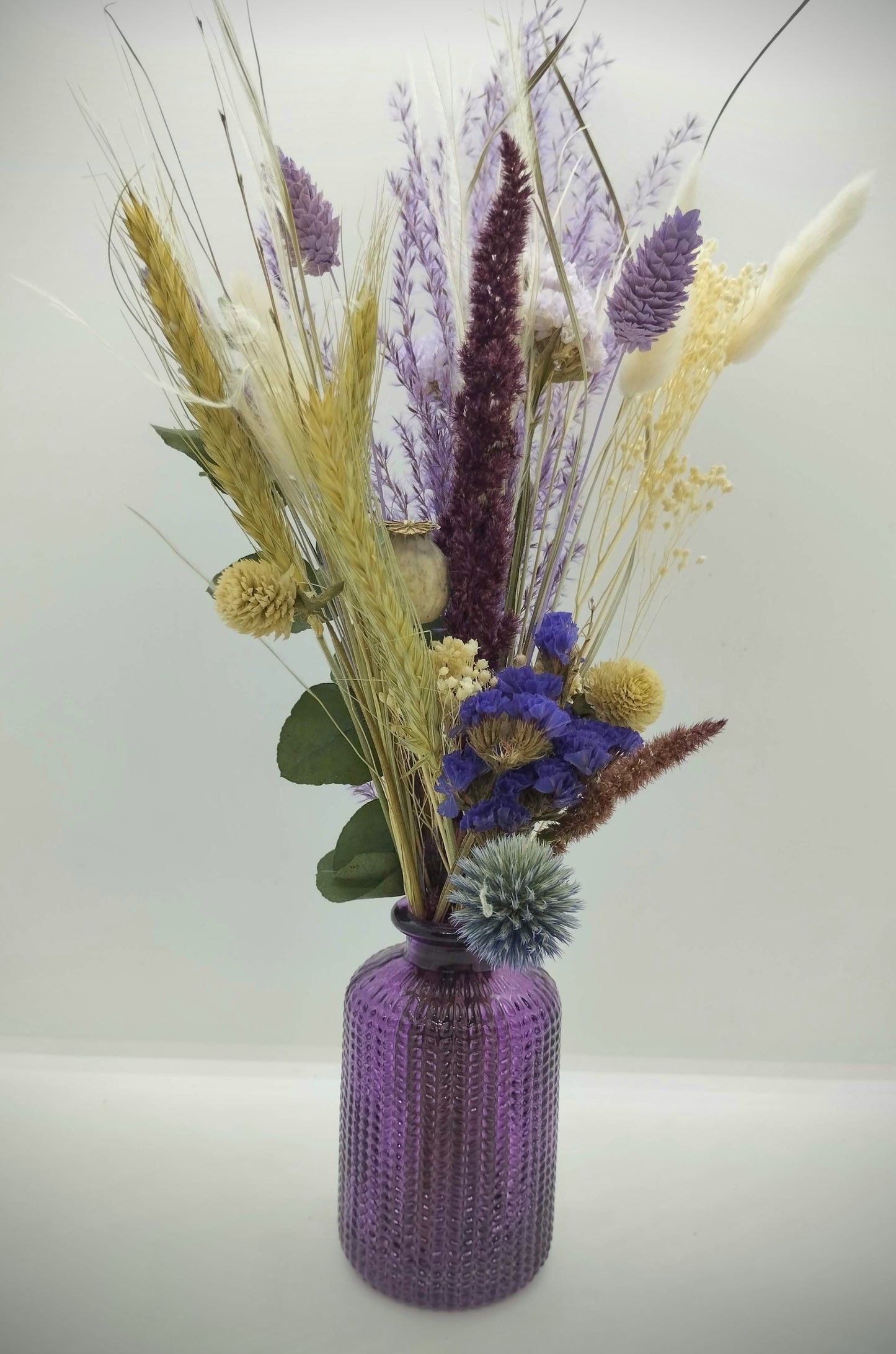Droogbloemen in kleurrijk vaasje