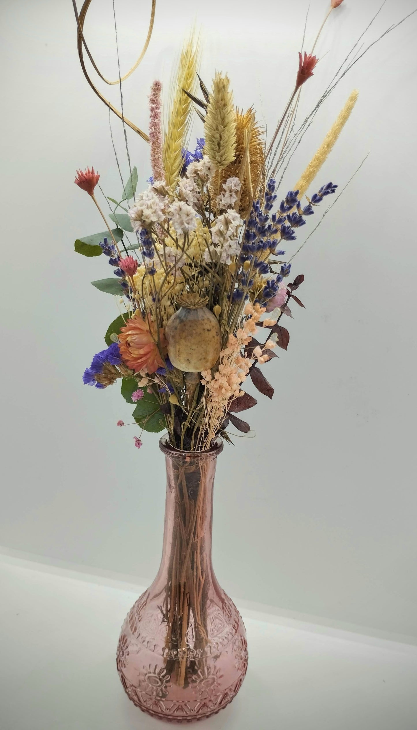 Droogbloemen in kleurrijk vaasje
