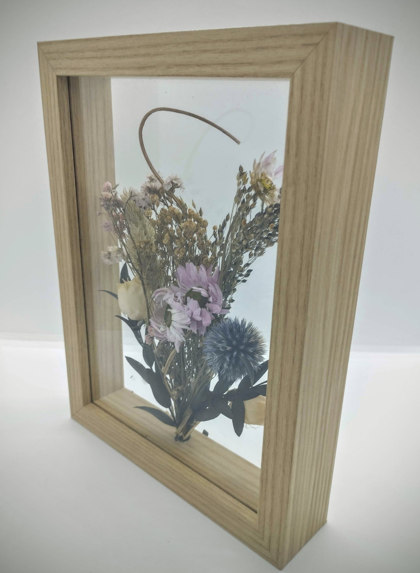 Droogbloemen in houten kader