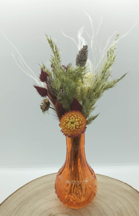 Droogbloemen in kleurrijk vaasje